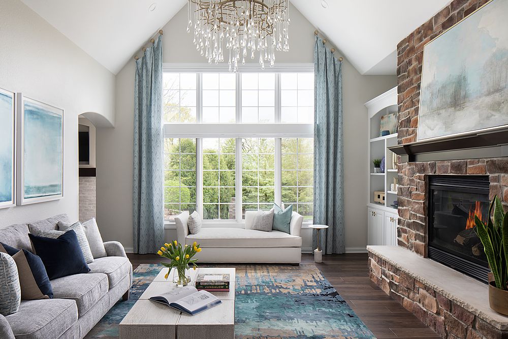 Tall windows almost certainly mean you need custom window treatments. Layering textiles in a room is an art for an interior designer.